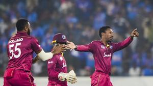 West Indies bowler Khary Pierre with teammates celebrates the dismissal.(PTI) West Indies bowler Khary Pierre with teammates celebrates the dismissal.(PTI)
