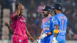 India's skipper Virat Kohli and West Indies bowler talk as batsman KL Rahul looks on.(PTI) India's skipper Virat Kohli and West Indies bowler talk as batsman KL Rahul looks on.(PTI)