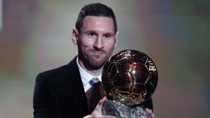 Lionel Messi holds the trophy of the Golden Ball award ceremony in Paris.(AP) Lionel Messi holds the trophy of the Golden Ball award ceremony in Paris.(AP)