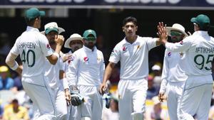 File image: Pakistan's Naseem Shah, center, celebrates with his team after getting the wicket of Australia's David Warner during their cricket test match in Brisbane.(AP) File image: Pakistan's Naseem Shah, center, celebrates with his team after getting the wicket of Australia's David Warner during their cricket test match in Brisbane.(AP)