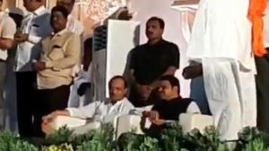 NCP’s Ajit Pawar sitting next to Devendra Fadnavis at a wedding in Solapur. (Video grab) NCP’s Ajit Pawar sitting next to Devendra Fadnavis at a wedding in Solapur. (Video grab)