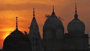 Birds fly at sunset over a Hindu temple in Ayodhya. (AP Photo) Birds fly at sunset over a Hindu temple in Ayodhya. (AP Photo)