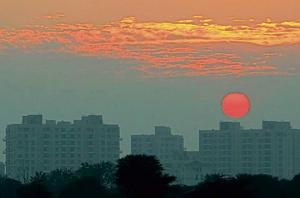 The setting sun paints the sky a vivid crimson in Mohali on Tuesday.(Gurminder Singh/HT) The setting sun paints the sky a vivid crimson in Mohali on Tuesday.(Gurminder Singh/HT)