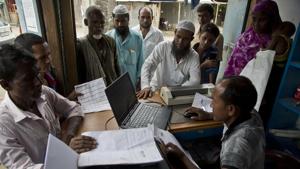 Villagers checking their names in the final list of the National Register of Citizens (NRC) in Assam’s Morigaon district.(AP Photo) Villagers checking their names in the final list of the National Register of Citizens (NRC) in Assam’s Morigaon district.(AP Photo)