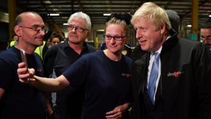 After Prime Minister Boris Johnson delivered milk and rustled up a pie for photo ops on Wednesday, a poll of opinion polls suggested two close scenarios: a slender Conservative majority or a hung parliament, both of which may not exactly resolve the Brexit imbroglio.(REUTERS) After Prime Minister Boris Johnson delivered milk and rustled up a pie for photo ops on Wednesday, a poll of opinion polls suggested two close scenarios: a slender Conservative majority or a hung parliament, both of which may not exactly resolve the Brexit imbroglio.(REUTERS)