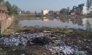 Over one acre land near the school premises, at Ullana village in Ghanaur block, has turned into a pond of waste water. Garbage of the village is also being dumped here.(HT PHOTO) Over one acre land near the school premises, at Ullana village in Ghanaur block, has turned into a pond of waste water. Garbage of the village is also being dumped here.(HT PHOTO)
