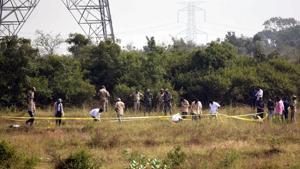 Police officers stand guard at the spot where accused in the rape and murder of the woman veterinarian were killed in an encounter, in Hyderabad on Friday(ANI) Police officers stand guard at the spot where accused in the rape and murder of the woman veterinarian were killed in an encounter, in Hyderabad on Friday(ANI)