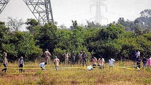 Police officers stand guard at the spot where accused in the rape and murder of the woman veterinarian were killed in an encounter, in Hyderabad.(ANI File) Police officers stand guard at the spot where accused in the rape and murder of the woman veterinarian were killed in an encounter, in Hyderabad.(ANI File)