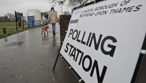 A voter with her dog arrives at a polling station in Twickenham, England, Thursday, Dec. 12, 2019.(AP photo) A voter with her dog arrives at a polling station in Twickenham, England, Thursday, Dec. 12, 2019.(AP photo)
