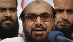 Hafiz Saeed was indicted on Wednesday by a Pakistani anti-terrorism court along with three of his close aides on terror financing charges.(AP) Hafiz Saeed was indicted on Wednesday by a Pakistani anti-terrorism court along with three of his close aides on terror financing charges.(AP)