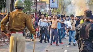 Protestors, amid tear-smoke clash with the police during their march against the Citizenship (Amendment) Bill, 2019, in Guwahati, Wednesday, Dec. 11, 2019.(Photo: PTI) Protestors, amid tear-smoke clash with the police during their march against the Citizenship (Amendment) Bill, 2019, in Guwahati, Wednesday, Dec. 11, 2019.(Photo: PTI)