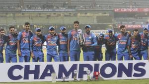 Players of Indian cricket team pose with the winner's trophy after their win in the third Twenty20 international cricket match against West Indies in Mumbai.(AP) Players of Indian cricket team pose with the winner's trophy after their win in the third Twenty20 international cricket match against West Indies in Mumbai.(AP)