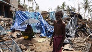 A man and a woman seen amid destruction in the aftermath of Cyclone Fani, at Satapada, in Puri district of Odisha.(Arabinda Mahapatra / Hindustan Times) A man and a woman seen amid destruction in the aftermath of Cyclone Fani, at Satapada, in Puri district of Odisha.(Arabinda Mahapatra / Hindustan Times)