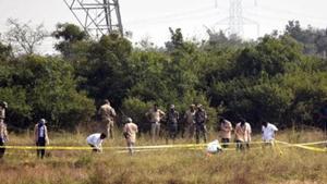 Police officers stand guard at the spot where the four men accused in the rape and murder of the woman veterinarian were killed in an encounter in Hyderabad.(STYLE PHOTO SERVICE.) Police officers stand guard at the spot where the four men accused in the rape and murder of the woman veterinarian were killed in an encounter in Hyderabad.(STYLE PHOTO SERVICE.)