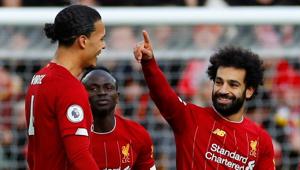 Liverpool's Mohamed Salah celebrates scoring their first goal with Virgil van Dijk and Sadio Mane.(REUTERS) Liverpool's Mohamed Salah celebrates scoring their first goal with Virgil van Dijk and Sadio Mane.(REUTERS)
