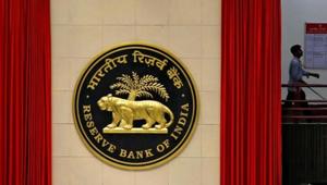A worker walks past the logo of Reserve Bank of India (RBI) inside its office in New Delhi, India July 8, 2019. REUTERS/Anushree Fadnavis/Files(Reuters File Photo) A worker walks past the logo of Reserve Bank of India (RBI) inside its office in New Delhi, India July 8, 2019. REUTERS/Anushree Fadnavis/Files(Reuters File Photo)