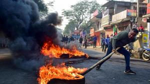 A demonstrator burns tyres during a protest rally against CAB, Kamrup district Assam, December 13, 2019(PTI) A demonstrator burns tyres during a protest rally against CAB, Kamrup district Assam, December 13, 2019(PTI)