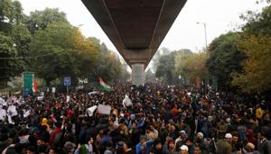 Demonstrators attend a protest against a new citizenship law, outside Jamia Millia Islamia university in New Delhi, December 16, 2019.(REUTERS) Demonstrators attend a protest against a new citizenship law, outside Jamia Millia Islamia university in New Delhi, December 16, 2019.(REUTERS)