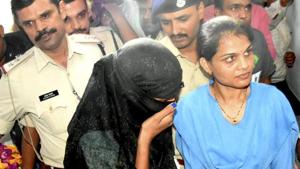 Indore police produce Monika Yadav, one of the accused in extortion case during a court appearance in Bhopal,(PTI) Indore police produce Monika Yadav, one of the accused in extortion case during a court appearance in Bhopal,(PTI)