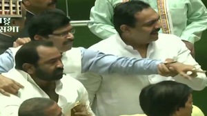 Inside the assembly some of the members waved the posters, and at least a couple of BJP legislators rushed towards the Speaker’s podium raising slogans and demanding immediate implementation of the Sena’s earlier demand.(ANI) Inside the assembly some of the members waved the posters, and at least a couple of BJP legislators rushed towards the Speaker’s podium raising slogans and demanding immediate implementation of the Sena’s earlier demand.(ANI)