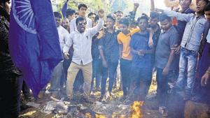 Protestors burn an unidentified effigy as the bandh has been announced by Prakash Ambedkar, on the mark of koregaon bhima violence in Pune, India, on Wednesday, January 3, 2018.(HT FILE Photo) Protestors burn an unidentified effigy as the bandh has been announced by Prakash Ambedkar, on the mark of koregaon bhima violence in Pune, India, on Wednesday, January 3, 2018.(HT FILE Photo)