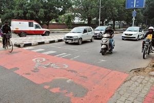 A faded zebra crossing and cycle track at the Sector 34/44 roundabout in Chandigarh. Keshav Singh/HT(Keshav Singh/HT) A faded zebra crossing and cycle track at the Sector 34/44 roundabout in Chandigarh. Keshav Singh/HT(Keshav Singh/HT)