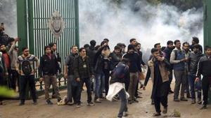 Police uses tear gas to disperse students protesting outside the Jamia Millia Islamia University against the Citizenship Amendment Bill, in New Delhi, India, Friday, Dec. 13, 2019.(AP) Police uses tear gas to disperse students protesting outside the Jamia Millia Islamia University against the Citizenship Amendment Bill, in New Delhi, India, Friday, Dec. 13, 2019.(AP)