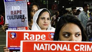 Protesters walk with placards against sexual assaults on women, in Kolkata.(AP Photo) Protesters walk with placards against sexual assaults on women, in Kolkata.(AP Photo)