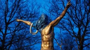 A statue of the Swedish football player Zlatan Ibrahimovic is seen covered with a blue plastic bag and a toilet seat.(via REUTERS) A statue of the Swedish football player Zlatan Ibrahimovic is seen covered with a blue plastic bag and a toilet seat.(via REUTERS)