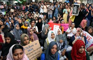 Students hold placards during a protest against the Citizenship Amendment Act, outside Reserve Bank of India in Kochi on Wednesday.(Photo: ANI) Students hold placards during a protest against the Citizenship Amendment Act, outside Reserve Bank of India in Kochi on Wednesday.(Photo: ANI)