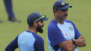 Indian cricket captain Virat Kohli, left, speaks with coach Ravi Shastri during a training session.(AP) Indian cricket captain Virat Kohli, left, speaks with coach Ravi Shastri during a training session.(AP)