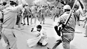 A lathi-charge in New Delhi in 1993; (top) policewomen use canes to prop a shield from the rain.(From HT Archive) A lathi-charge in New Delhi in 1993; (top) policewomen use canes to prop a shield from the rain.(From HT Archive)