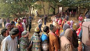 People wait in a queue to cast their vote at a polling station during the fifth phase of Jharkhand Assembly Election, in Dumka on Friday.(ANI Photo) People wait in a queue to cast their vote at a polling station during the fifth phase of Jharkhand Assembly Election, in Dumka on Friday.(ANI Photo)