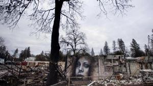 Work crews have been cutting down trees and clearing burned-out lots, but Paradise is mostly a ghost town where survivors still dig for keepsakes in the foundations of their homes.(AP) Work crews have been cutting down trees and clearing burned-out lots, but Paradise is mostly a ghost town where survivors still dig for keepsakes in the foundations of their homes.(AP)
