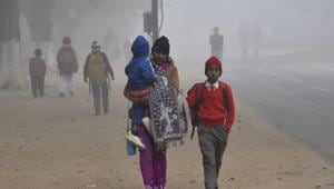 Students on a way to school during a cold and foggy morning(HT File) Students on a way to school during a cold and foggy morning(HT File)