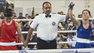 Referee raises the hand of boxer Mary Kom after her bout against Nikhat Zareen.(PTI)
