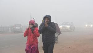 People are seen wearing warm clothes amid dense fog on a cold morning, at Rajpath, New Delhi, on Monday.(Arvind Yadav/HT Photo) People are seen wearing warm clothes amid dense fog on a cold morning, at Rajpath, New Delhi, on Monday.(Arvind Yadav/HT Photo)