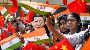 School students wave the national flag of China and India ahead of Chinese President Xi Jinping's visit in Chennai.(Photo: PTI)