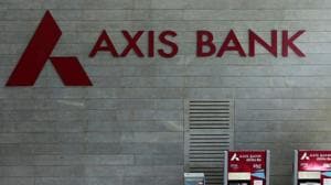 Axis Bank's logo is seen next to ATM machines at its corporate headquarters in Mumbai.(REUTERS Photo) Axis Bank's logo is seen next to ATM machines at its corporate headquarters in Mumbai.(REUTERS Photo)