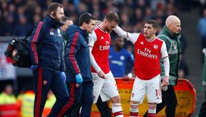 Arsenal's Calum Chambers with Lucas Torreira as he is substituted after sustaining an injury.(REUTERS) Arsenal's Calum Chambers with Lucas Torreira as he is substituted after sustaining an injury.(REUTERS)