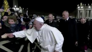 A woman grabs Pope Francis' hand and yanks him towards her, at Saint Peter's Square at the Vatican in this still image taken from a video, December 31, 2019. Vatican Media/Handout via REUTERS(via REUTERS)