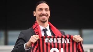 Zlatan Ibrahimovic holds up his AC Milan shirt after signing for AC Milan.(REUTERS) Zlatan Ibrahimovic holds up his AC Milan shirt after signing for AC Milan.(REUTERS)