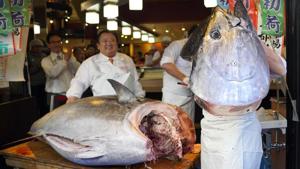 An employee poses with a newly-purchased tuna at a Sushizanmai restaurant, operated by Kiyomura Corp., in Tokyo, Japan, on Sunday, Jan. 5, 2020. A bluefin tuna weighing a staggering 276 kilograms (608 pounds) was sold for 193.2 million yen ($1.79 million) on Sunday at a Tokyo fish market, the second-highest price on record. Photographer: Toru Hanai/Bloomberg (Bloomberg) An employee poses with a newly-purchased tuna at a Sushizanmai restaurant, operated by Kiyomura Corp., in Tokyo, Japan, on Sunday, Jan. 5, 2020. A bluefin tuna weighing a staggering 276 kilograms (608 pounds) was sold for 193.2 million yen ($1.79 million) on Sunday at a Tokyo fish market, the second-highest price on record. Photographer: Toru Hanai/Bloomberg (Bloomberg)