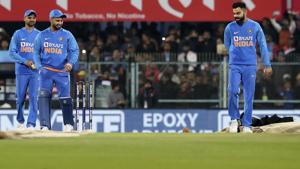 Indian captain Virat Kohli, right, with his tame mates come to inspect the pitch after the rain(AP) Indian captain Virat Kohli, right, with his tame mates come to inspect the pitch after the rain(AP)