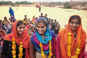 Garlanded Hira Banu, Vachchi and Amira being showered with petals upon becoming first girls off village to pass class tenth, at Bhadla village, in Jodhpur.(HT Photo) Garlanded Hira Banu, Vachchi and Amira being showered with petals upon becoming first girls off village to pass class tenth, at Bhadla village, in Jodhpur.(HT Photo)