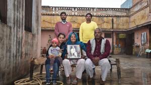 Sunheri Devi holds a photograph of her father-in-law Jhuman Chowdhry, who offered his residence and fields for the film. The house also served as the home of the lead character Bharat played by the actor Manoj Kumar.(Raj K Raj/HT PHOTO) Sunheri Devi holds a photograph of her father-in-law Jhuman Chowdhry, who offered his residence and fields for the film. The house also served as the home of the lead character Bharat played by the actor Manoj Kumar.(Raj K Raj/HT PHOTO)