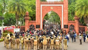 Police personnel stand guard outside Aligarh Muslim University (AMU) as students protest against the passing of Citizenship Amendment Bill, in Aligarh on December 13, 2019.(PTI File Photo) Police personnel stand guard outside Aligarh Muslim University (AMU) as students protest against the passing of Citizenship Amendment Bill, in Aligarh on December 13, 2019.(PTI File Photo)