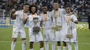 From left to right, Real Madrid's Casemiro, Real Madrid's Marcelo, Real Madrid's Vinicius Junior, Real Madrid's Eder Militao and Real Madrid's Rodrygo celebrate winning the Spanish Super Cup.(AP) From left to right, Real Madrid's Casemiro, Real Madrid's Marcelo, Real Madrid's Vinicius Junior, Real Madrid's Eder Militao and Real Madrid's Rodrygo celebrate winning the Spanish Super Cup.(AP)