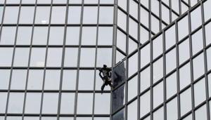 French climber Alain Robert, also known as "Spiderman", scales the Tour Total skyscraper.(REUTERS) French climber Alain Robert, also known as "Spiderman", scales the Tour Total skyscraper.(REUTERS)