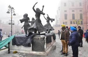 Police inspecting the site where the marble panels of the platform on which statues of folk dancers have been put up on Heritage Street were damaged by vandals in Amritsar on Wednesday.(Sameer Sehgal/HT) Police inspecting the site where the marble panels of the platform on which statues of folk dancers have been put up on Heritage Street were damaged by vandals in Amritsar on Wednesday.(Sameer Sehgal/HT)
